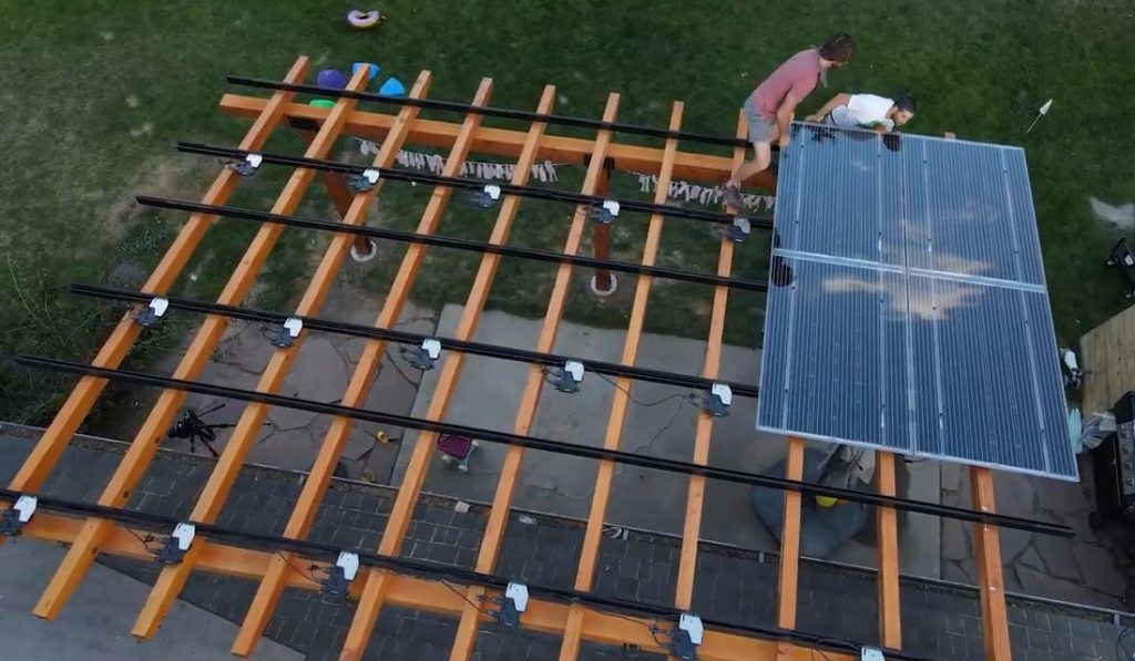 Solar panels are fitted to the top of the pergola.