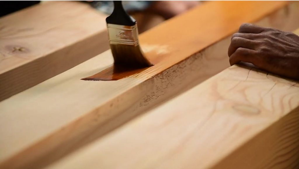 Staining the wood to be used for the solar pergola.