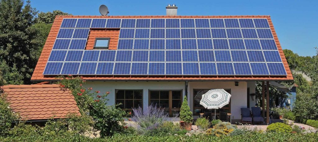 Rooftop solar panels provide clean, green energy for a residential home.