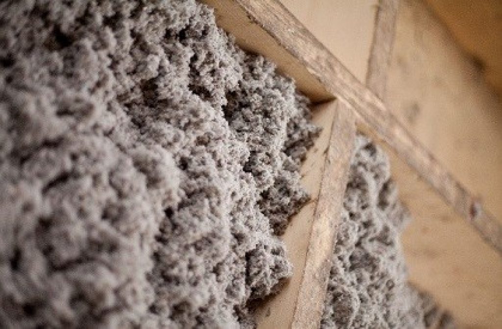 Green fiber insulation in a wall of a home. 