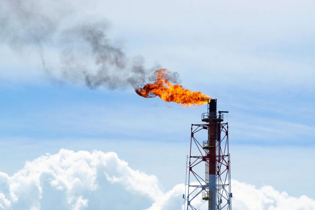 Methane gas is burnt off at oil and gas rigs.