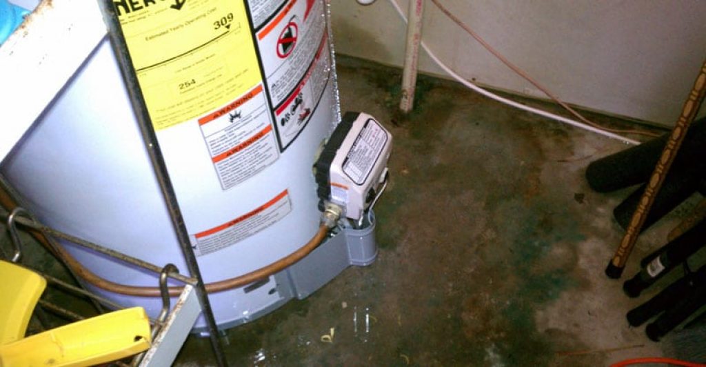 Leaking storage-tank water heater  —  tankless water heater pros and cons.
