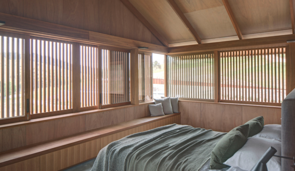 Timber battens are used to block direct sunlight in the summer months — passive solar heating.