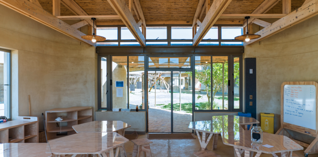 This classroom faces a courtyard which allows natural light into the building — passive solar heating.
