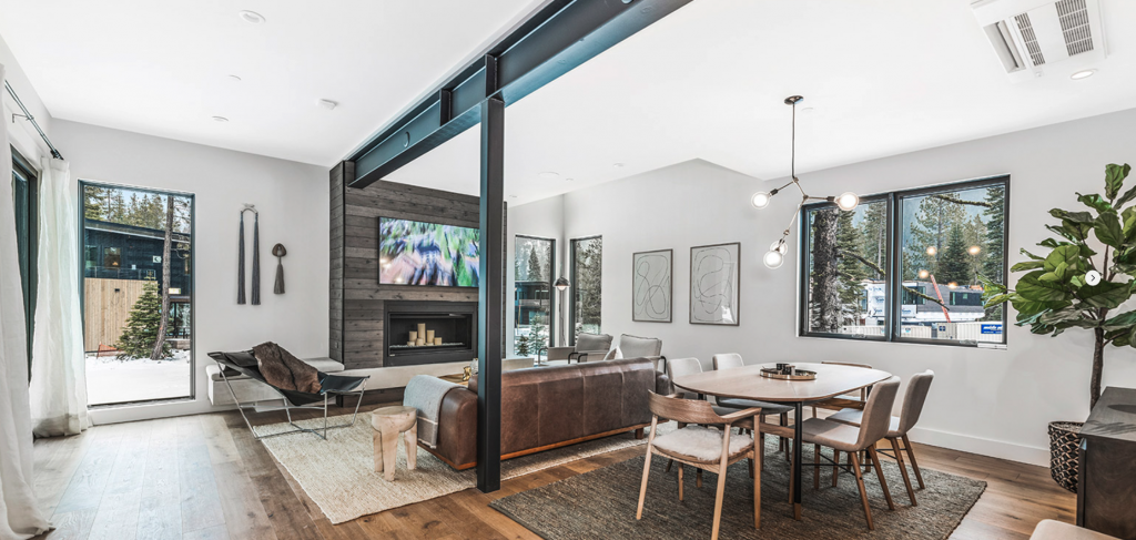 Large windows in the living spaces capture direct sunlight, warming the house.
