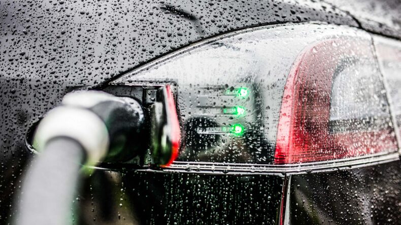 Electric Car Charging In The Rain