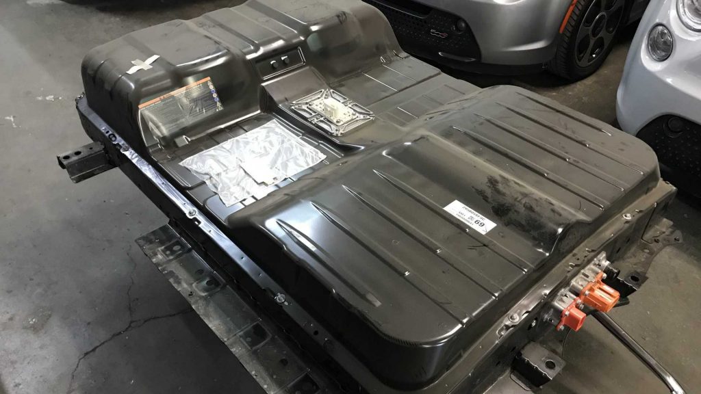 A Nissan Leaf battery being removed from a vehicle. 