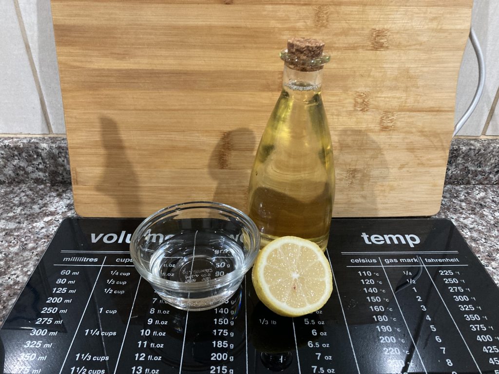 Vinegar, oil, and lemon juice are all you'll need for this DIY home furnish polish.