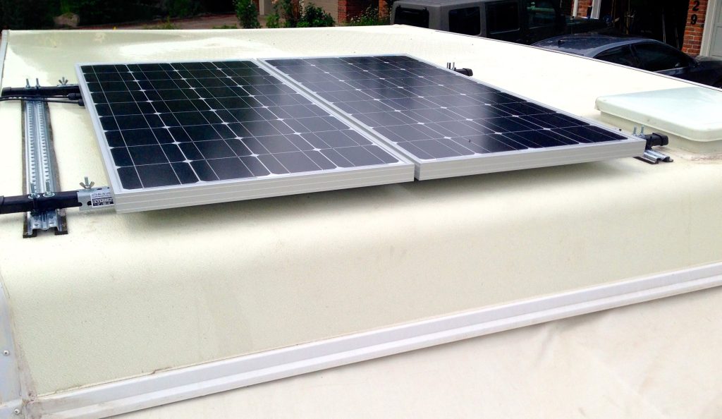 Mounted solar panels on an RV using strut channel.