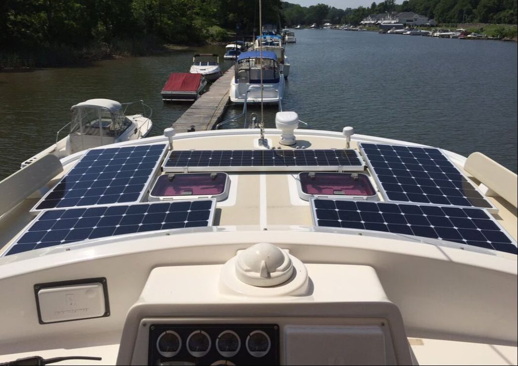 Rigid solar panels on a boat's rigid surface