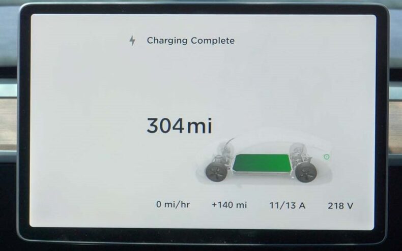 Tesla display showing battery capacity in terms of how many miles can be driven.