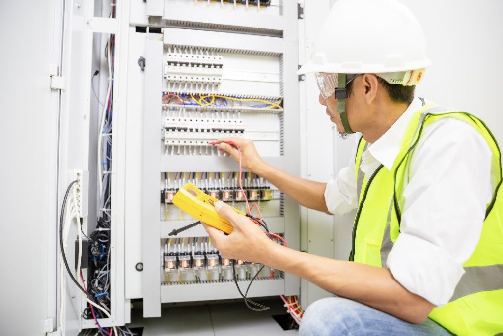 Engineer inspecting an electrical system.